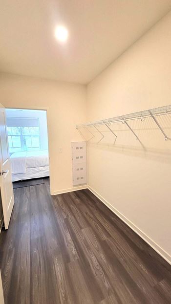 an empty bedroom with a closet and a window at Enclave Crystal Lake Townhomes and Apartments, Crystal Lake, Illinois